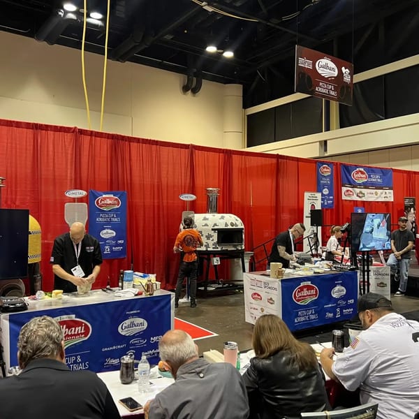 Chefs prepare pizza dough at the Galbani Pizza Cup and Acrobatic Trials event.